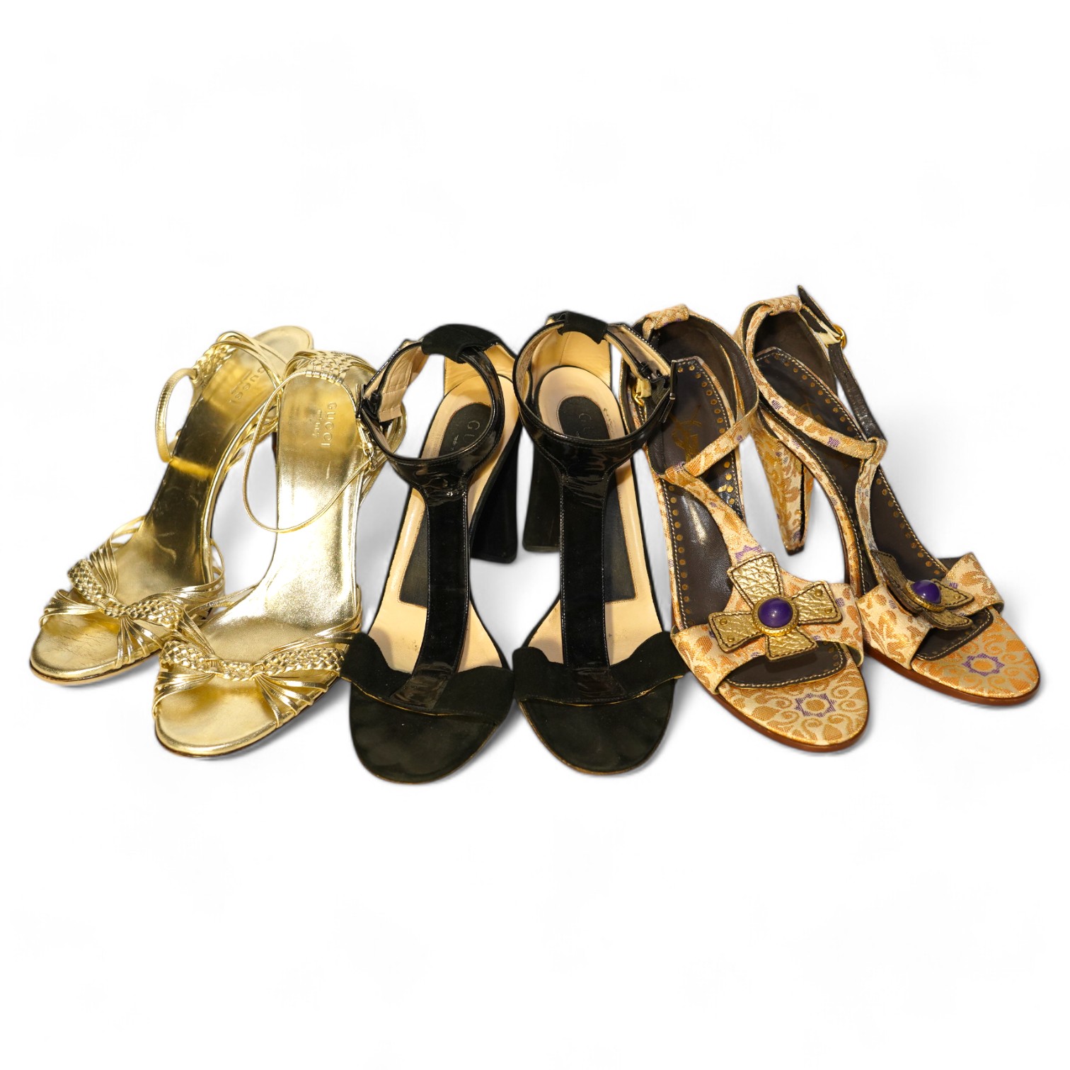 A pair of gold and bamboo Gucci sandals, a pair of Gucci black suede and patient leather sandals and a pair of Yves Saint Laurent gold canvas sandals, sizes 40.5 (Gucci) 40 (YSL)